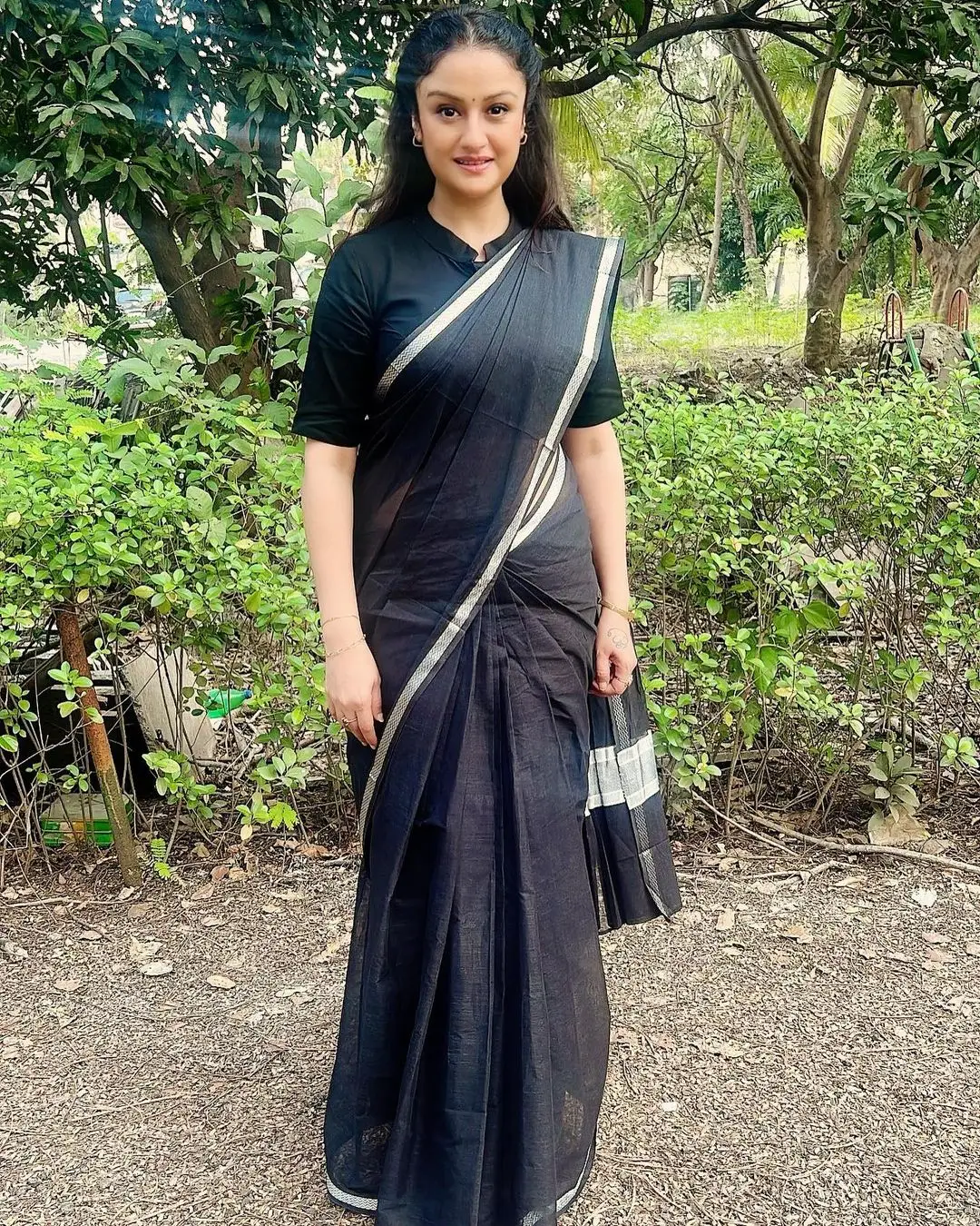 Sonia Agarwal Stills In Black Saree Blouse